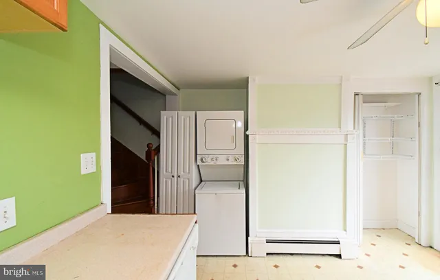 a hallway with sliding door and wooden door