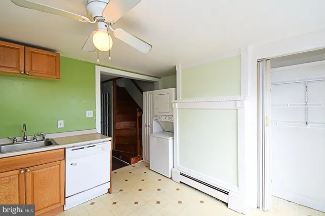 a bathroom with a sink a mirror and a shower