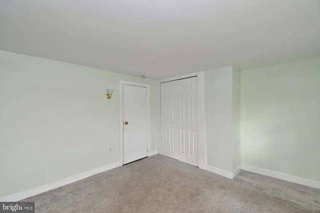 a view of an empty room and entryway