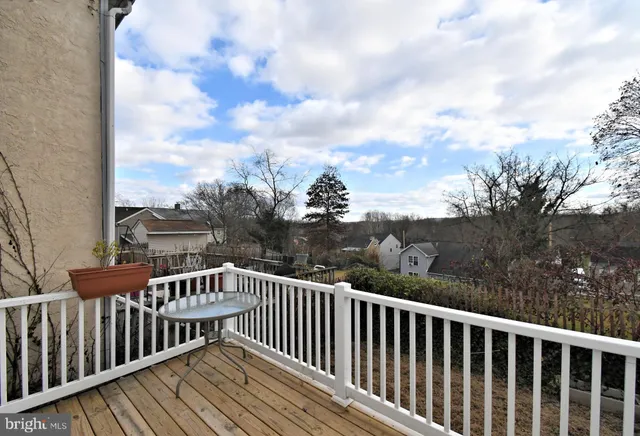 a view of a house with wooden deck