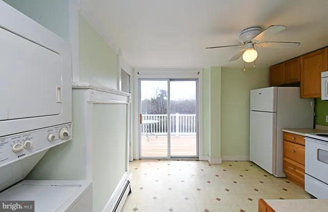 a bedroom with a bed and a refrigerator