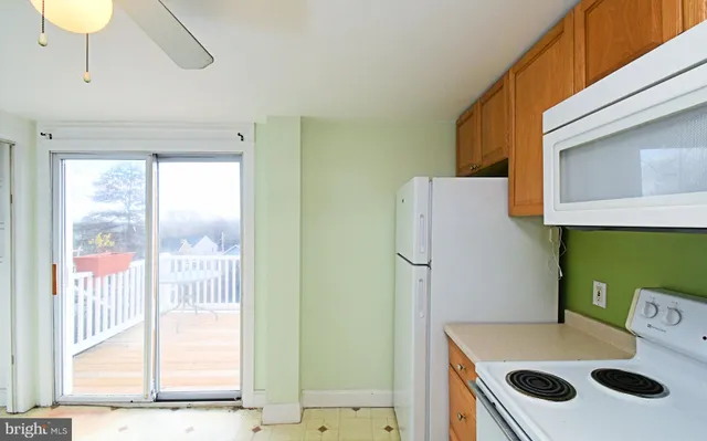 a bathroom with a sink a toilet and a shower