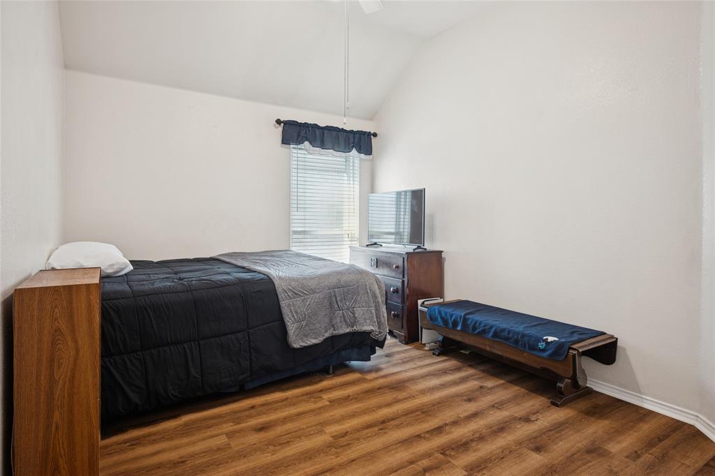 5501 Mt McKinley Road Fort Worth, TX 76137 - Photo 20 of 26 a bedroom with a bed and a cabinets