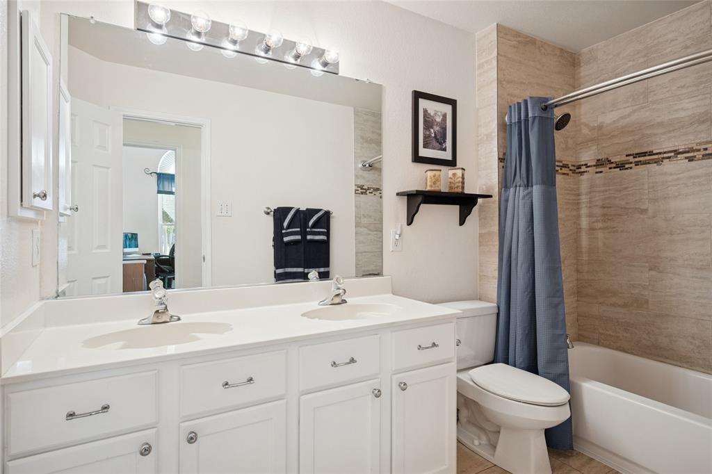 5501 Mt McKinley Road Fort Worth, TX 76137 - Photo 23 of 26 a bathroom with a sink toilet tub and shower