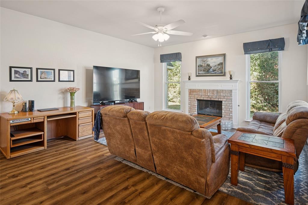 5501 Mt McKinley Road Fort Worth, TX 76137 - Photo 7 of 26 a living room with furniture and a fireplace