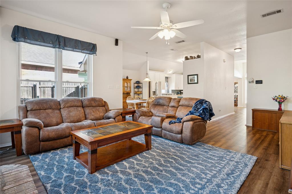 5501 Mt McKinley Road Fort Worth, TX 76137 - Photo 9 of 26 a living room with furniture wooden floor and a rug