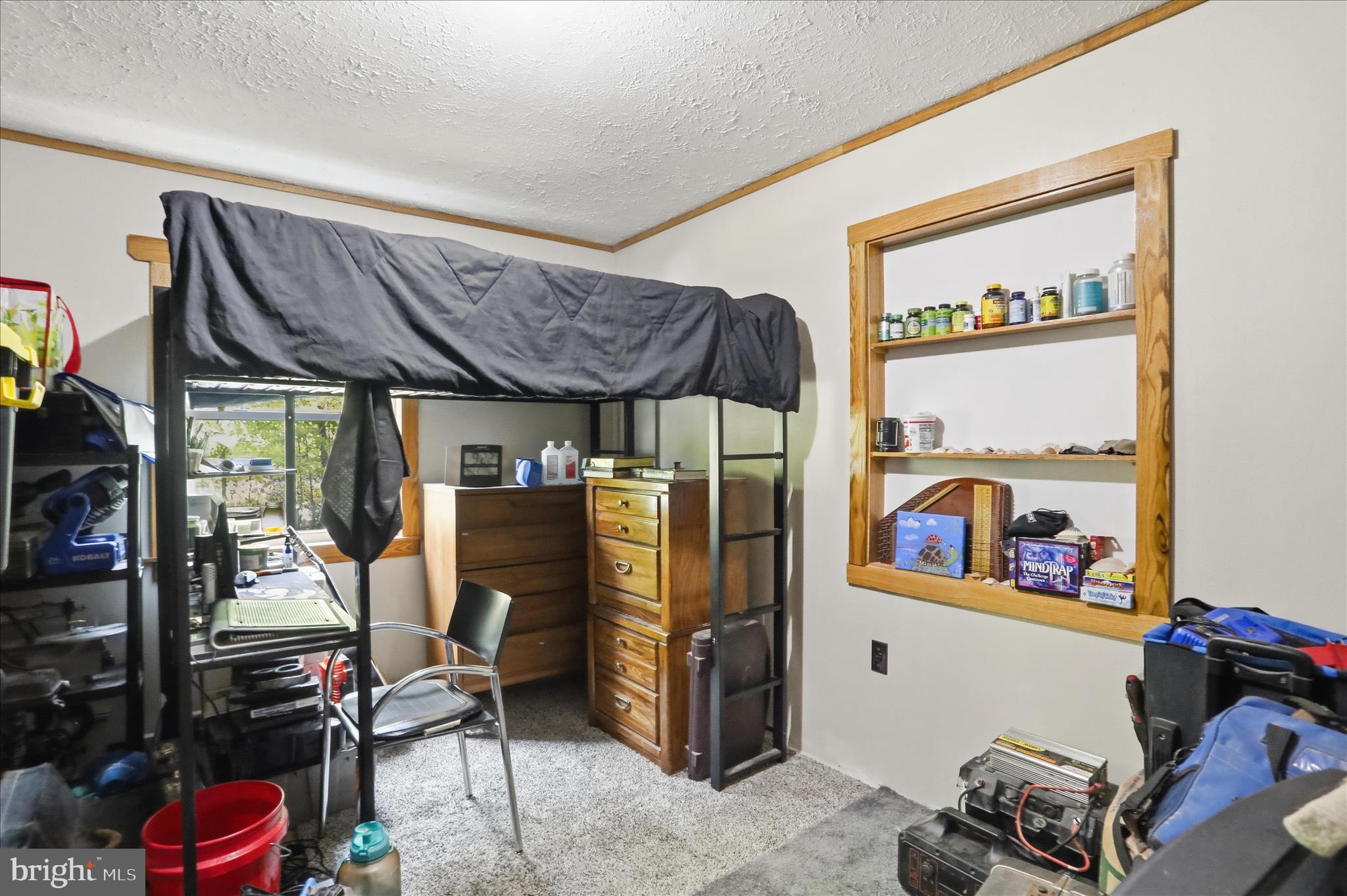 936 Johnny Cake Road Great Cacapon, WV 25422 - Photo 28 of 33 a room with furniture and a floor to ceiling window