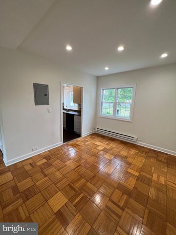 a bedroom with a bed and cabinets
