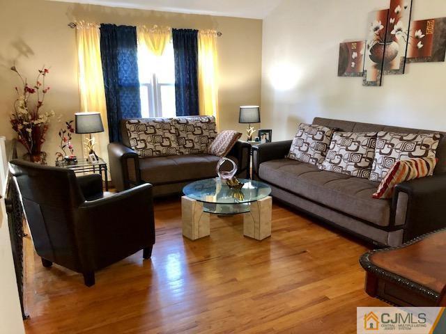 12 Atlantic Road Somerset, NJ 08873 - Photo 14 of 36 a living room with furniture and wooden floor