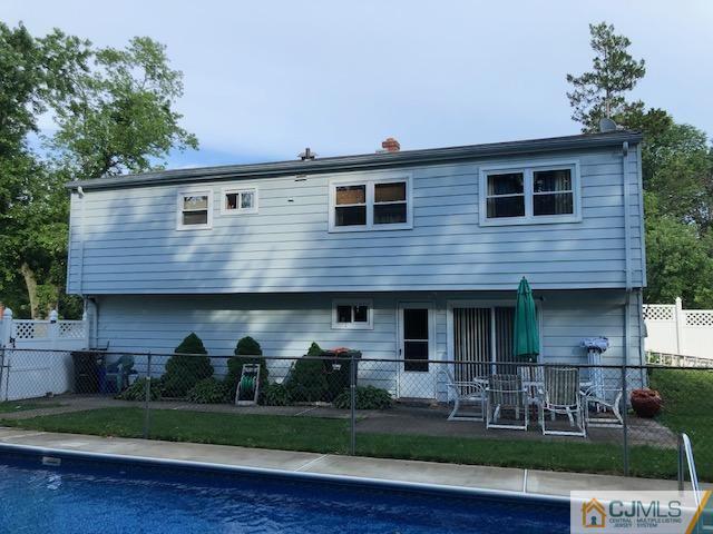 12 Atlantic Road Somerset, NJ 08873 - Photo 3 of 36 a front view of a house with garden