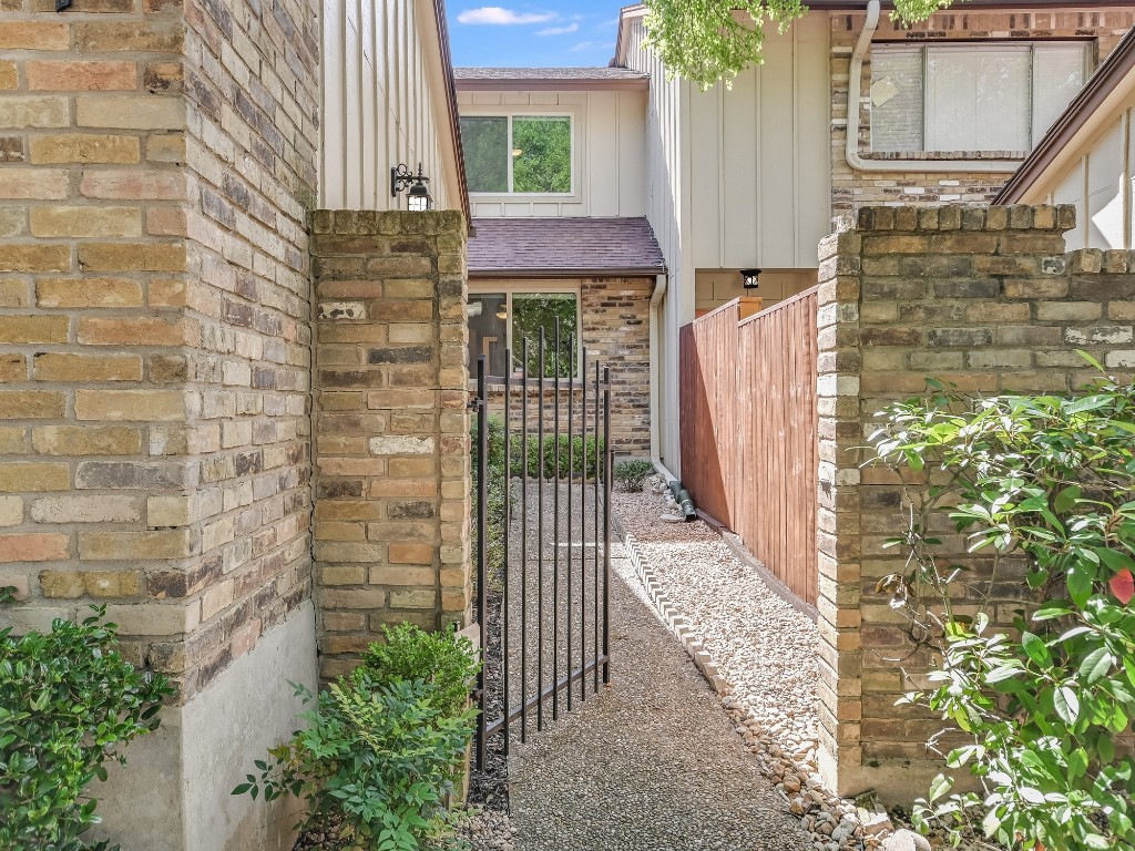 8314 Bent Tree Road Austin, TX 78759 - Photo 2 of 15 a view of entryway with a wooden door