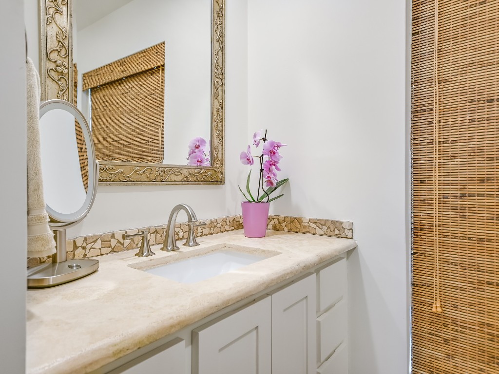 8314 Bent Tree Road Austin, TX 78759 - Photo 10 of 15 a bathroom with a granite countertop sink and a mirror