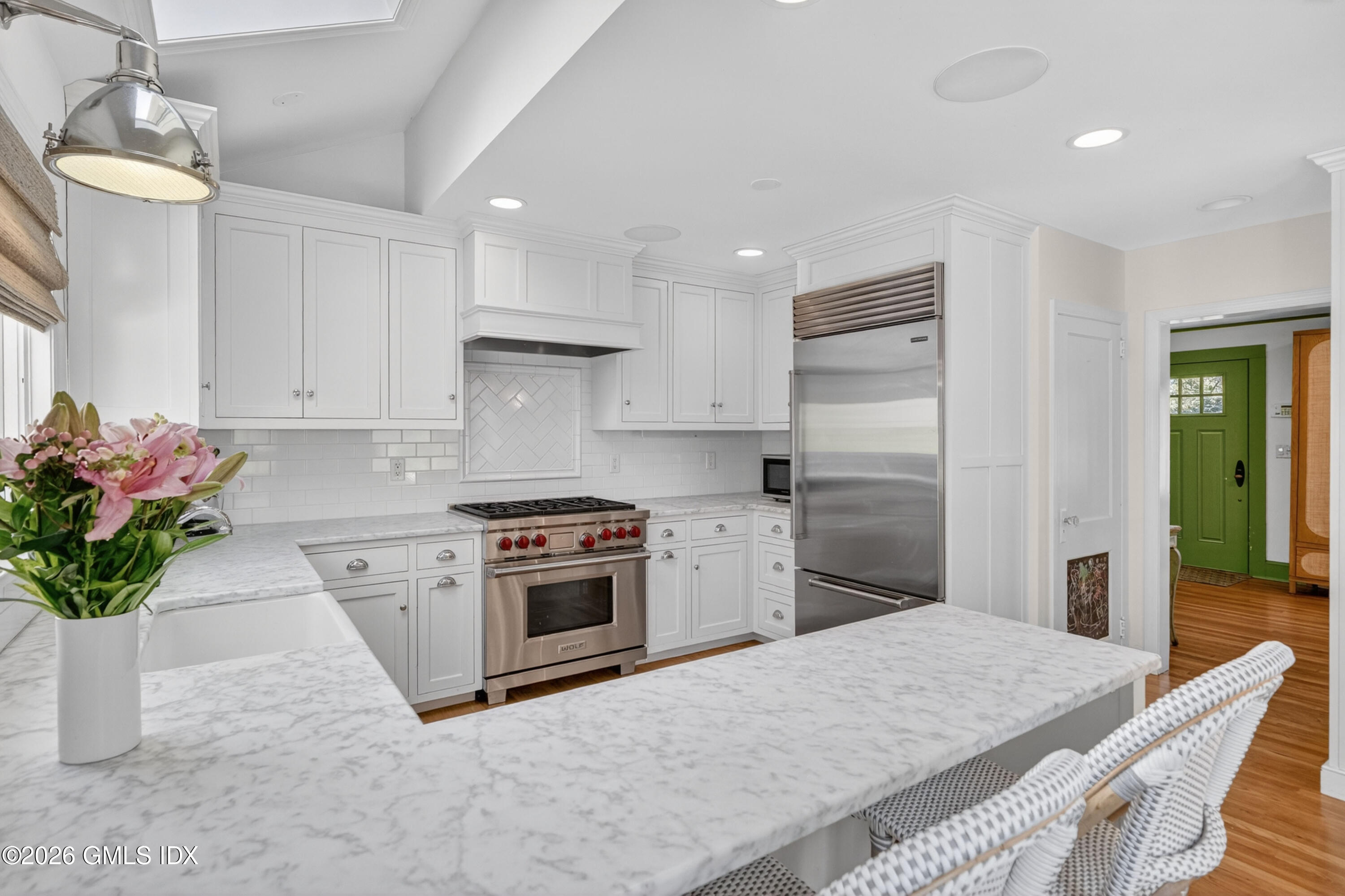 20 Ridge Road Cos Cob, CT 06807 - Photo 12 of 36 a kitchen with granite countertop a sink stainless steel appliances and cabinets