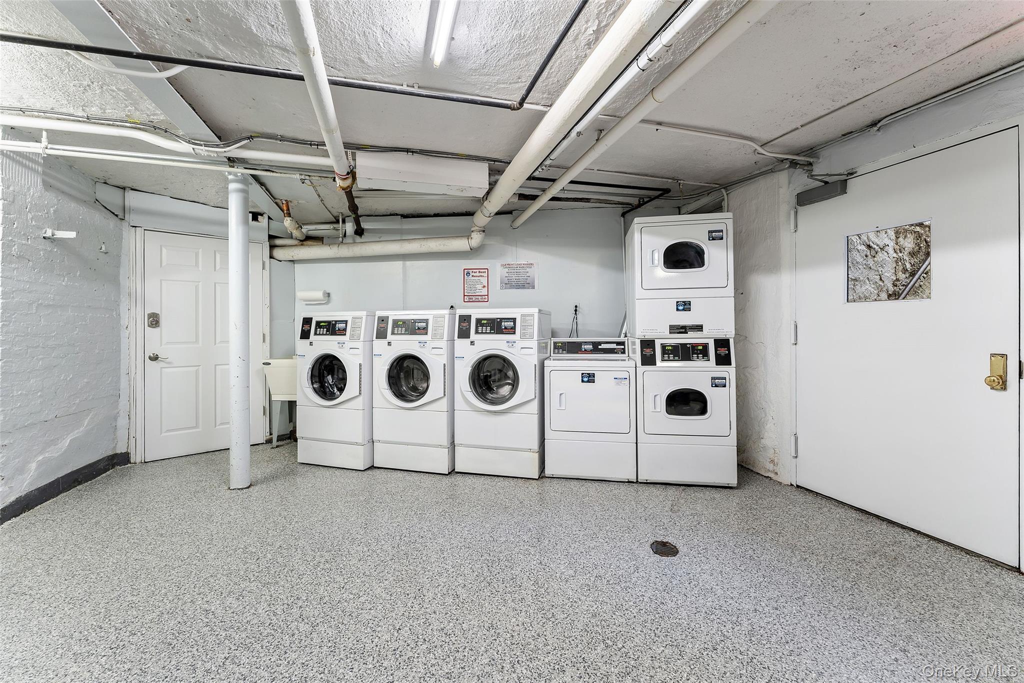 42 Pondfield Road West, Unit 6D Bronxville, NY 10708 - Photo 13 of 15 a utility room with dryer and washer
