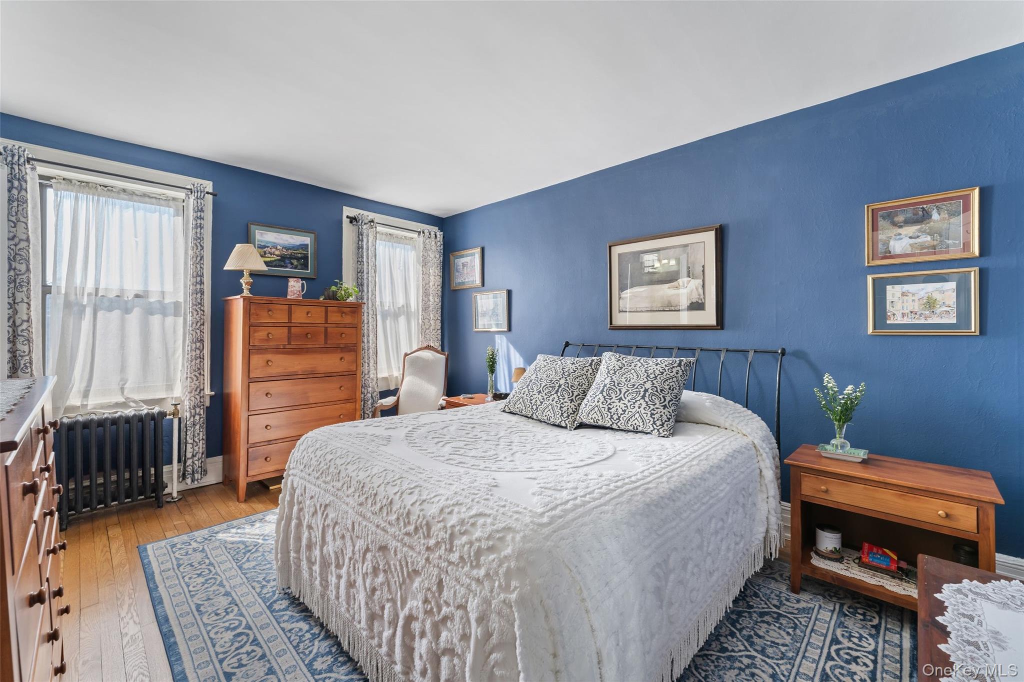 42 Pondfield Road West, Unit 6D Bronxville, NY 10708 - Photo 9 of 15 a bedroom with a bed and a couch