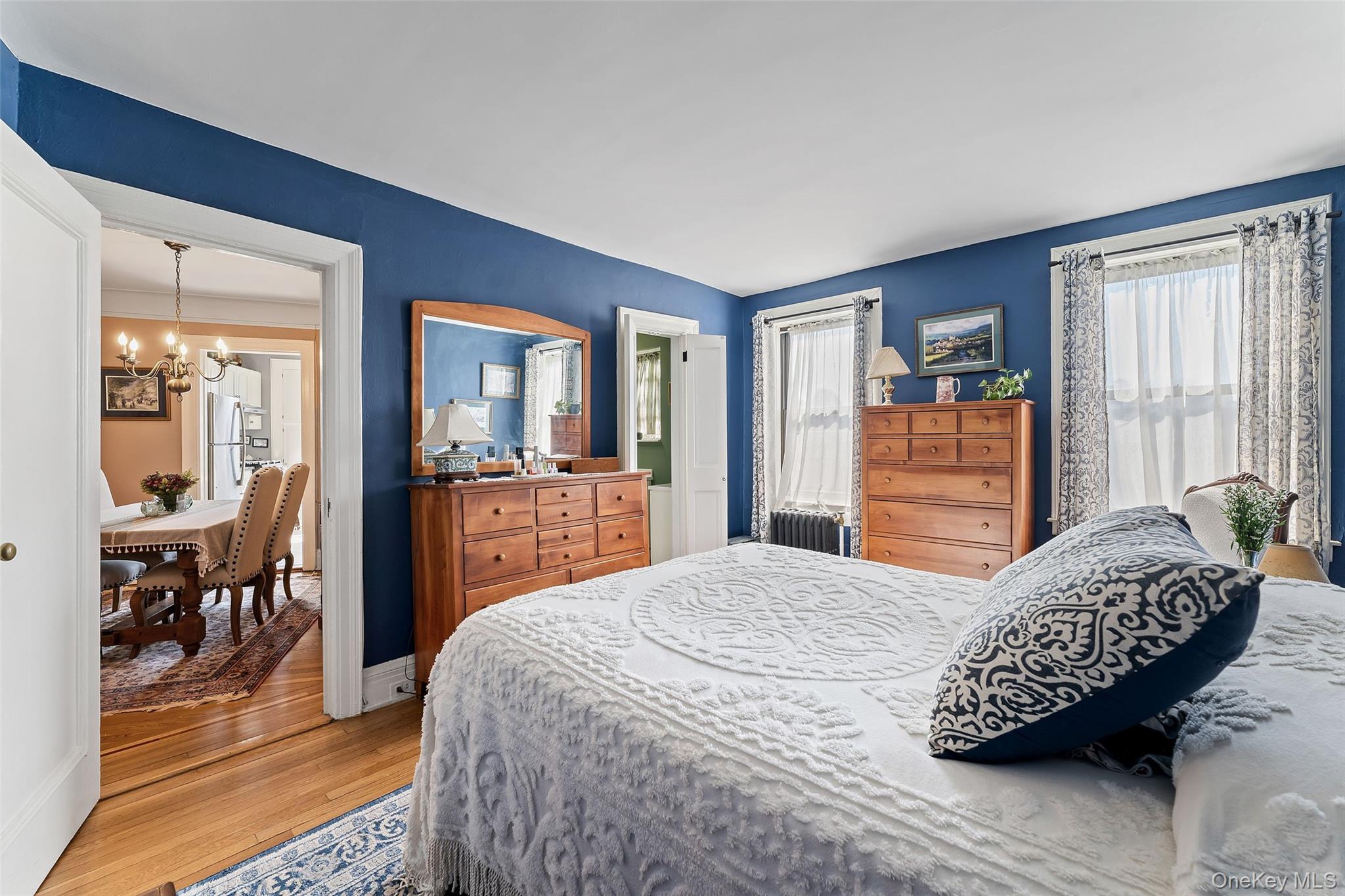 42 Pondfield Road West, Unit 6D Bronxville, NY 10708 - Photo 10 of 15 a bedroom with a bed and wooden floor