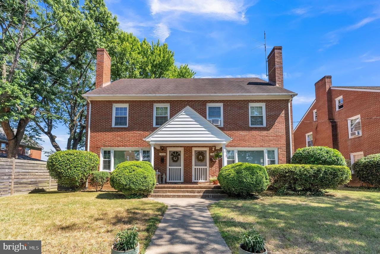 1408 Parcell Street Fredericksburg, VA 22401 - Photo 1 of 12 front view of a house with a yard