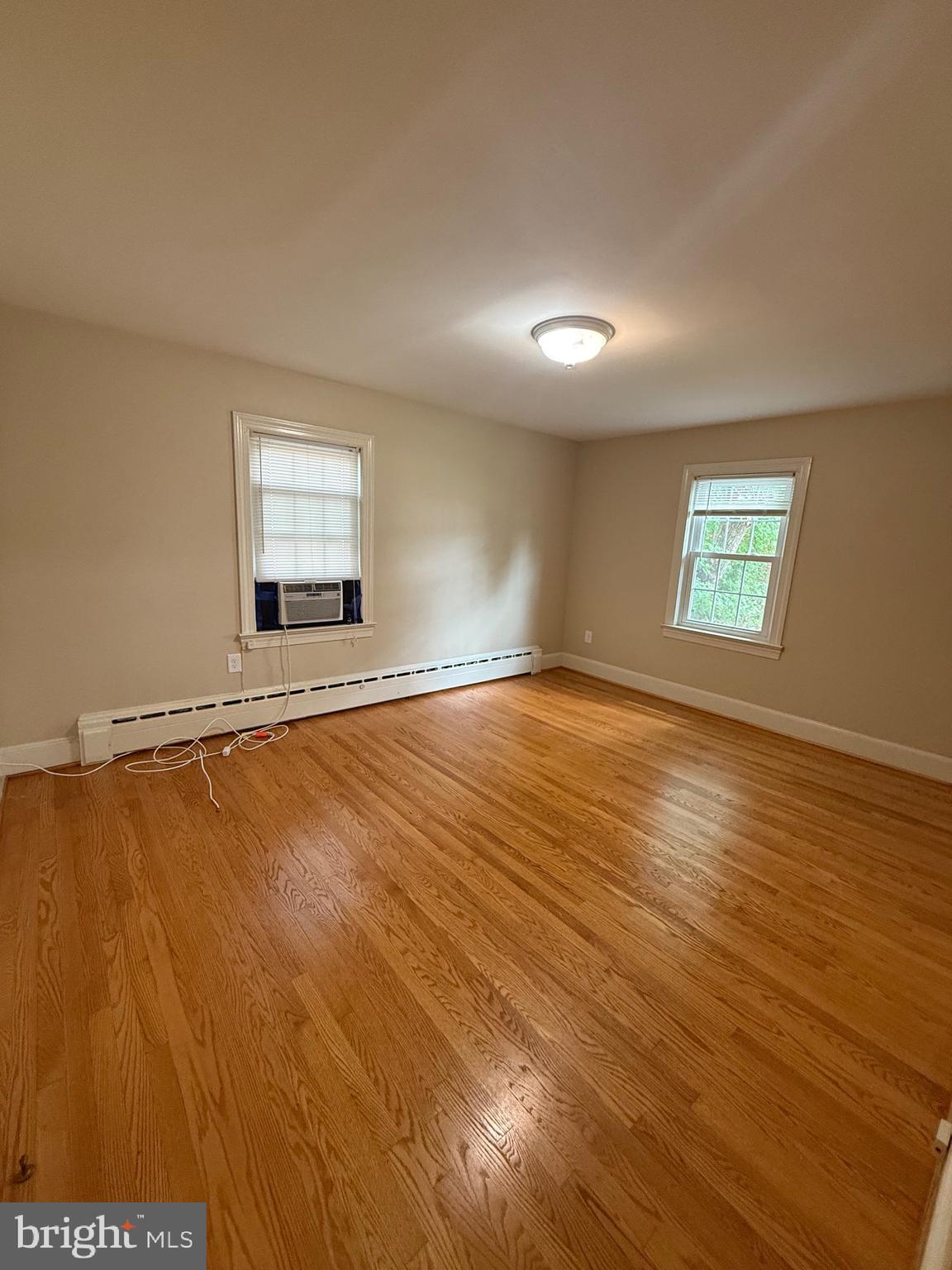 1408 Parcell Street Fredericksburg, VA 22401 - Photo 8 of 12 a view of an empty room with window and wooden floor