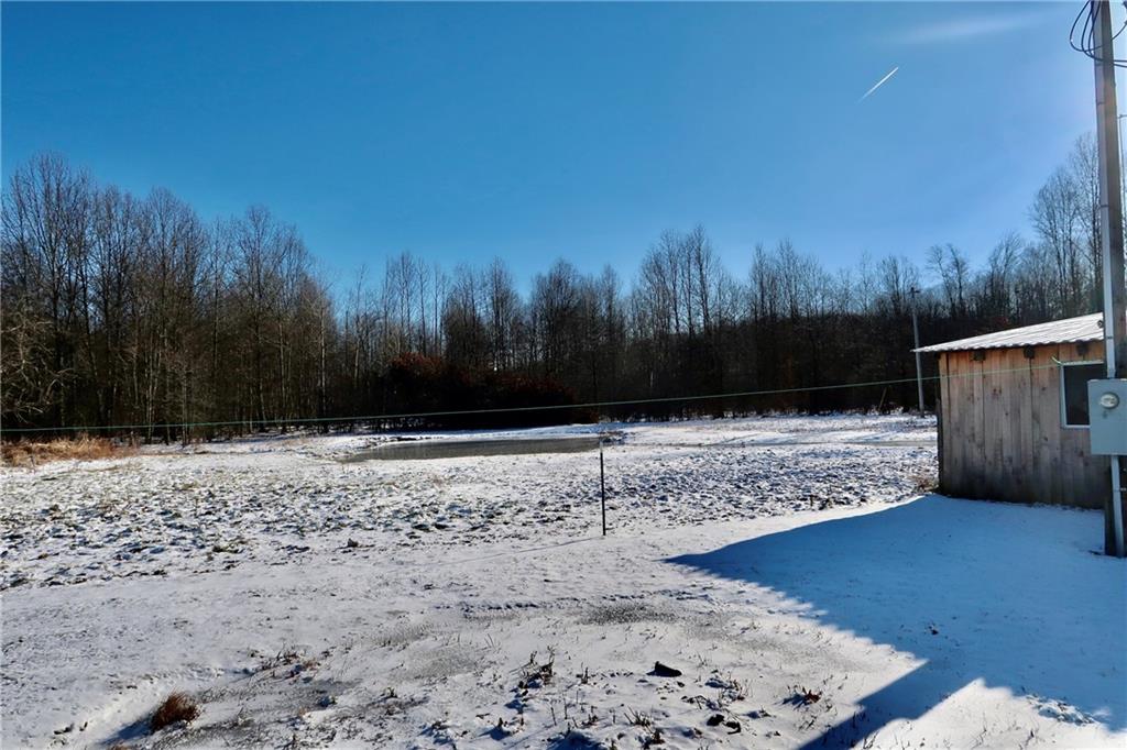 664 Airport Road Mercer, PA 16137 - Photo 11 of 20 a view of wooden floor with a yard