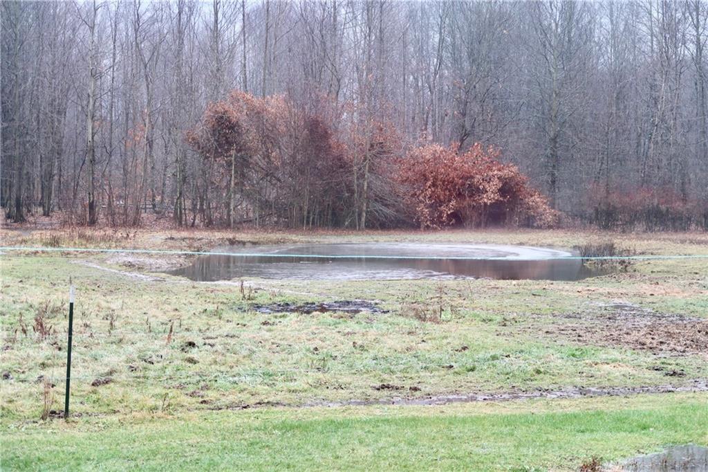 664 Airport Road Mercer, PA 16137 - Photo 16 of 20 a view of water heater and covered with wooden fence
