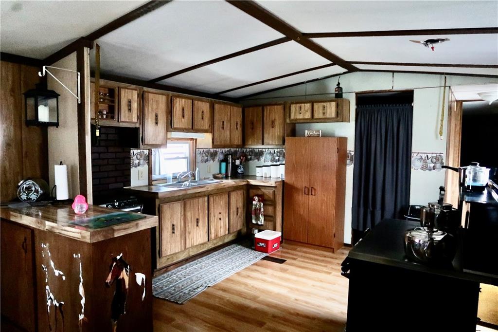664 Airport Road Mercer, PA 16137 - Photo 6 of 20 a kitchen with stainless steel appliances granite countertop a refrigerator stove top oven and sink