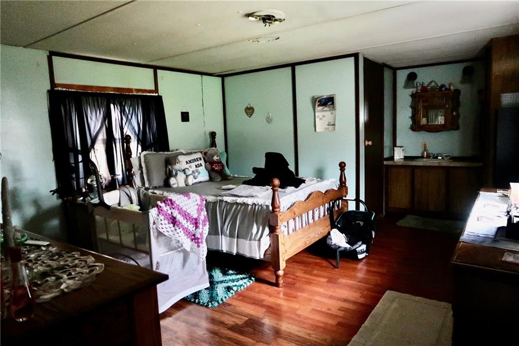 664 Airport Road Mercer, PA 16137 - Photo 8 of 20 a bed room with furniture and a window