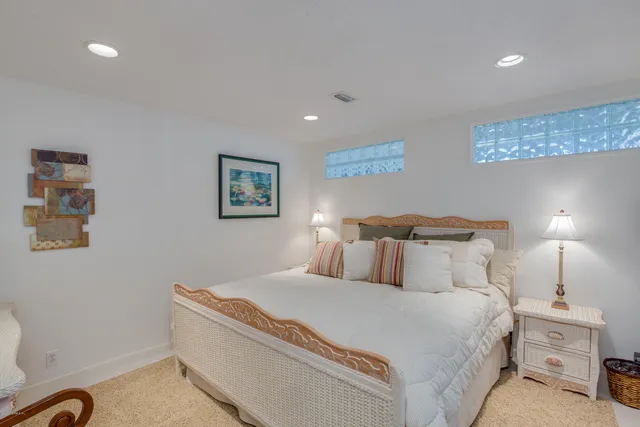 a bedroom with bed and a night stand