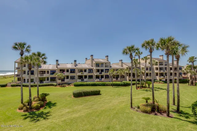 a view of a swimming pool with a table and chairs