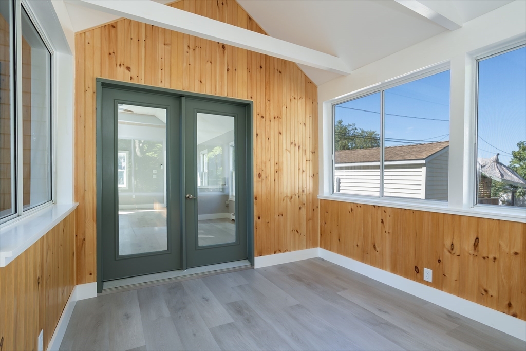 3 A Thompson Road, Unit A Bourne, MA 02532 - Photo 23 of 42 an empty room with wooden floor and windows