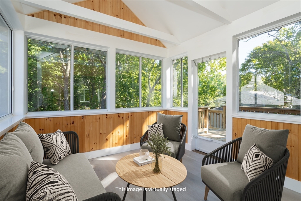 3 A Thompson Road, Unit A Bourne, MA 02532 - Photo 25 of 42 a living room with furniture and a large window