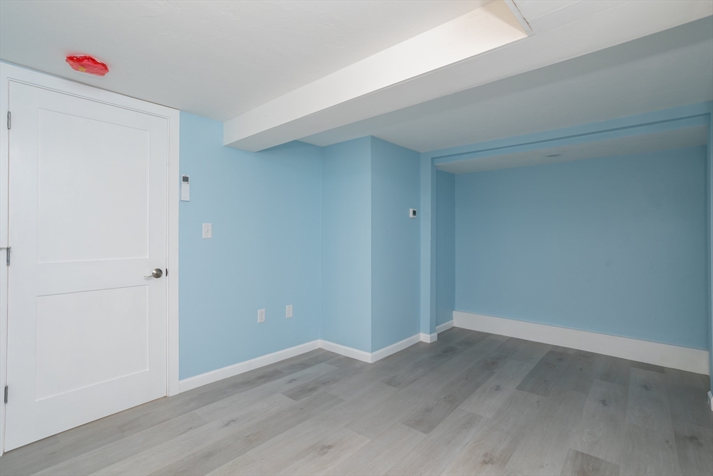 3 A Thompson Road, Unit A Bourne, MA 02532 - Photo 38 of 42 wooden floor in an empty room