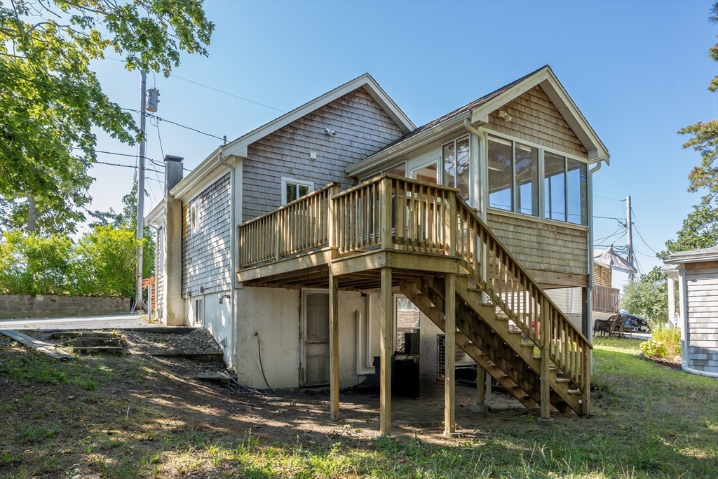 3 A Thompson Road, Unit A Bourne, MA 02532 - Photo 5 of 42 a view of a house with a yard
