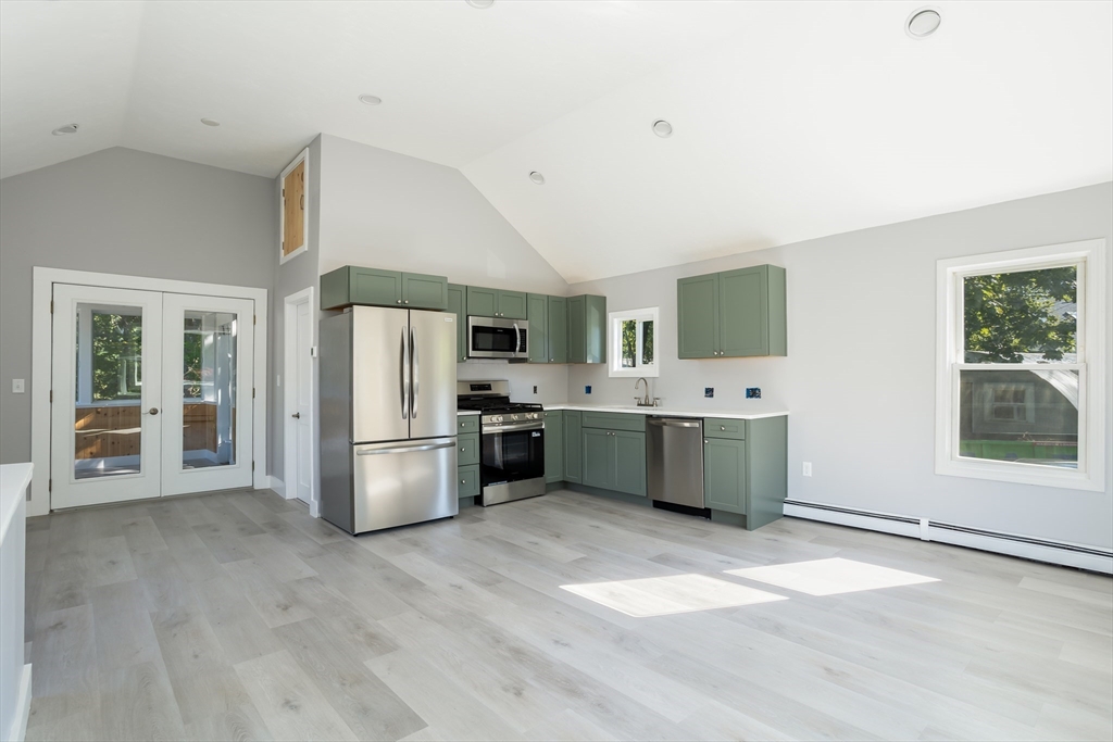 3 A Thompson Road, Unit A Bourne, MA 02532 - Photo 10 of 42 a kitchen with a sink cabinets and stainless steel appliances