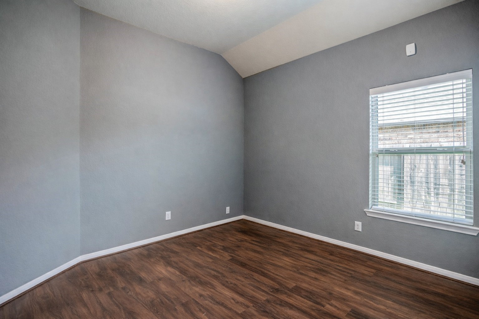 5319 Claymore Meadow Lane Spring, TX 77389 - Photo 25 of 34 a view of an empty room with wooden floor and a window