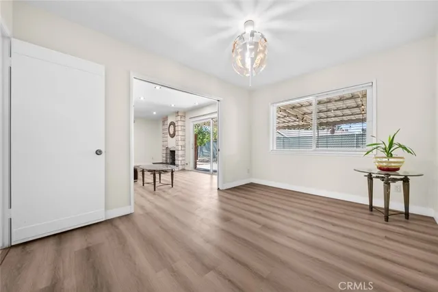 a view of a livingroom with furniture and wooden floor