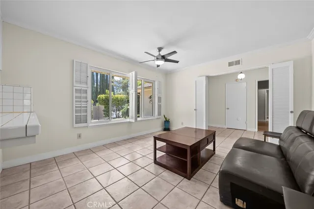a living room with furniture and a window