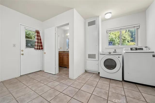 a view of a kitchen with washer and dryer