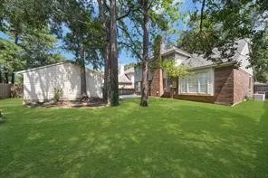 a backyard of a house with lots of green space