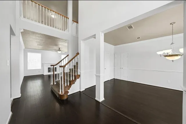 a view of an entryway with wooden floor