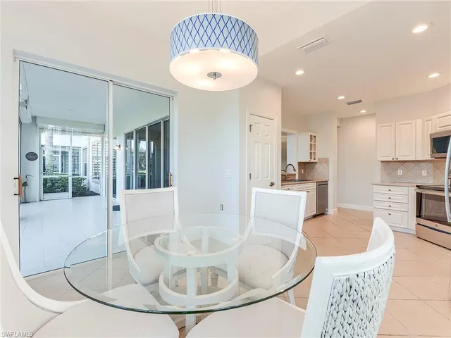 a kitchen with a stove a sink and a refrigerator