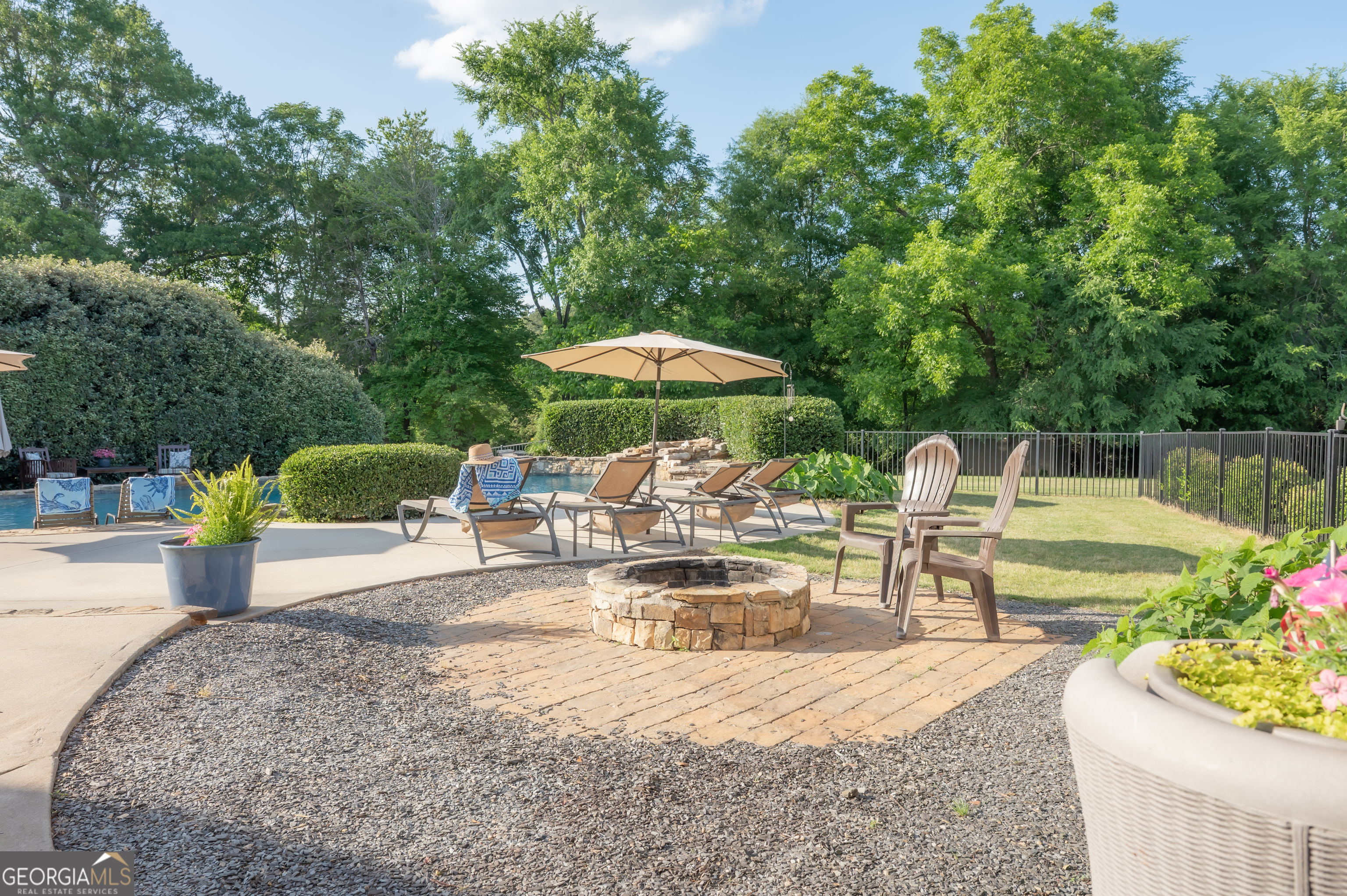 415 EAS Way Fayetteville, GA 30215 - Photo 47 of 70 a view of a swimming pool with chairs in patio
