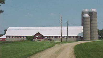 23091 Grade School Road Poplar Grove, IL 61065 - Photo 3 of 5 a view of a building and a yard
