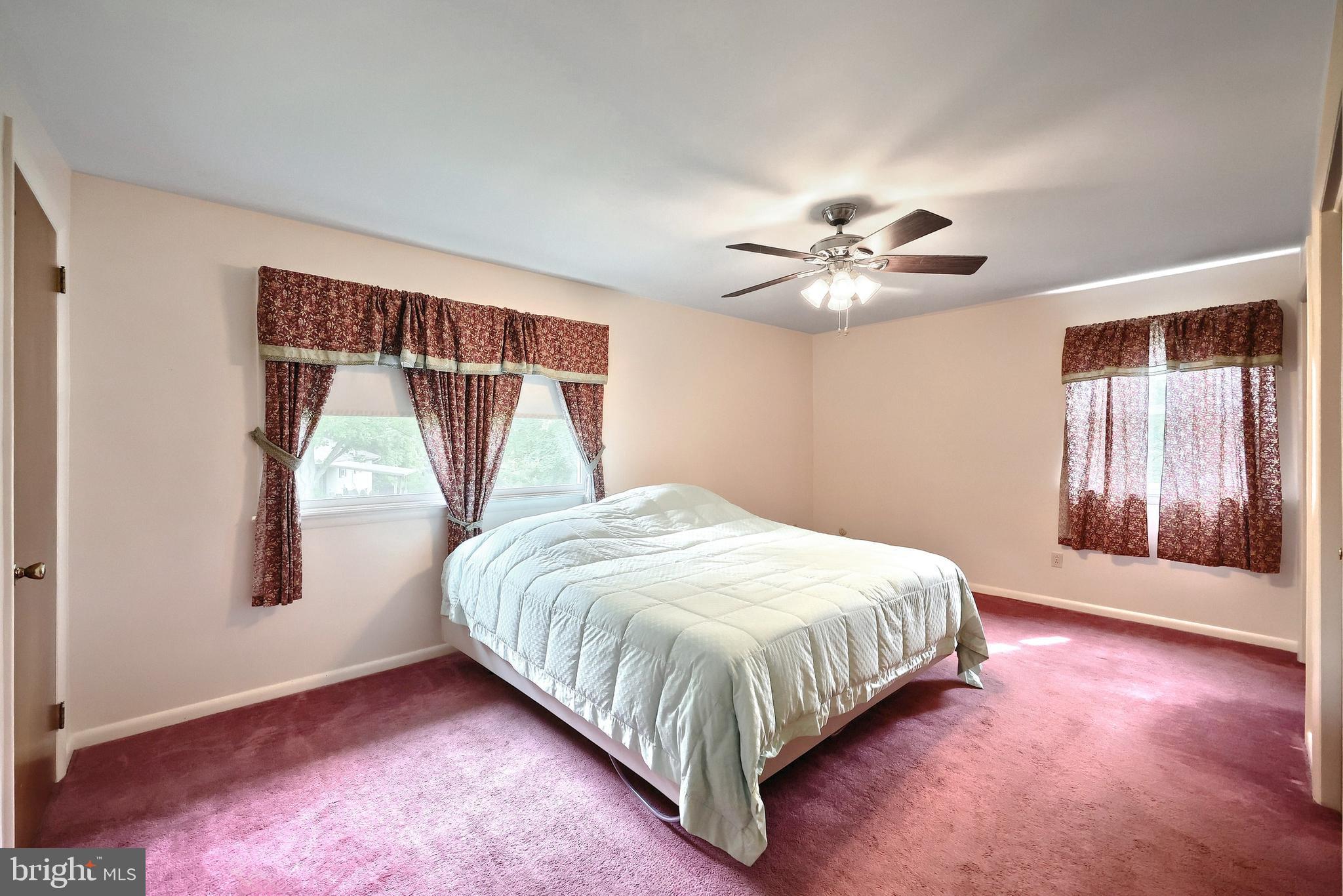 1840 Lilac Road York, PA 17408 - Photo 19 of 40 a bedroom with a bed and a ceiling fan