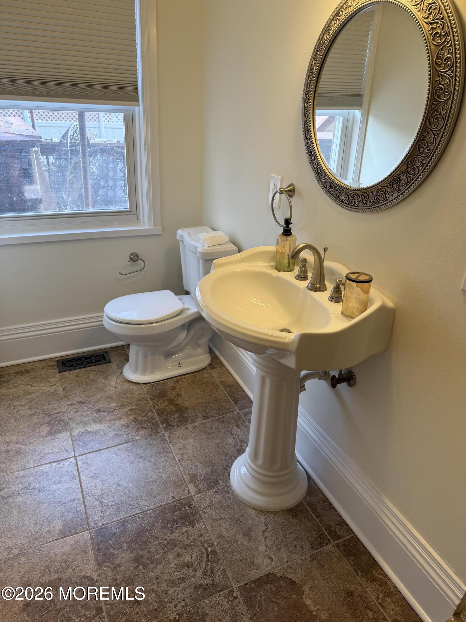 25 Monmouth Road, Unit 3 Oceanport, NJ 07757 - Photo 13 of 21 a bathroom with a toilet sink and mirror