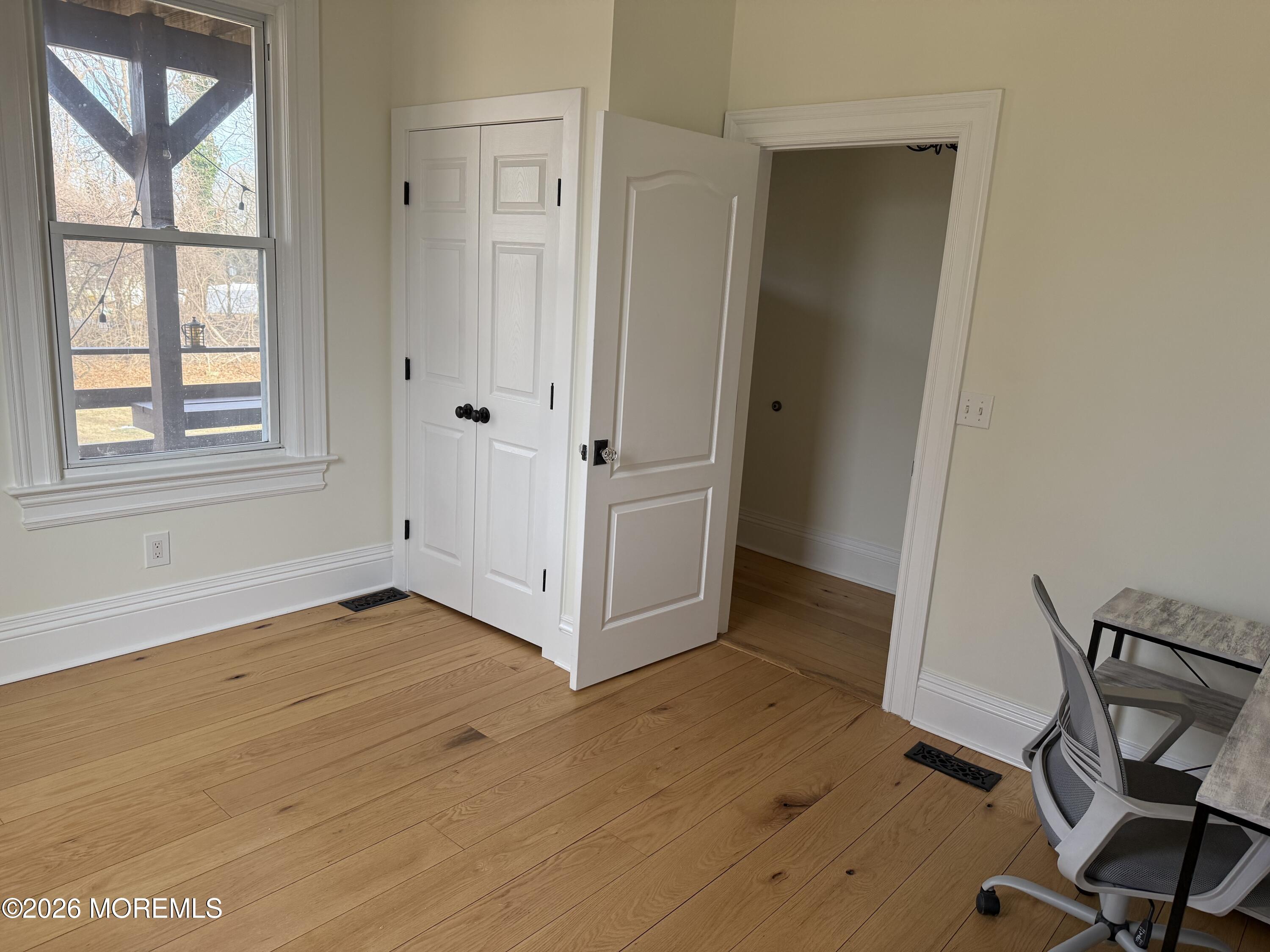 25 Monmouth Road, Unit 3 Oceanport, NJ 07757 - Photo 16 of 21 a view of a room with wooden floor and windows