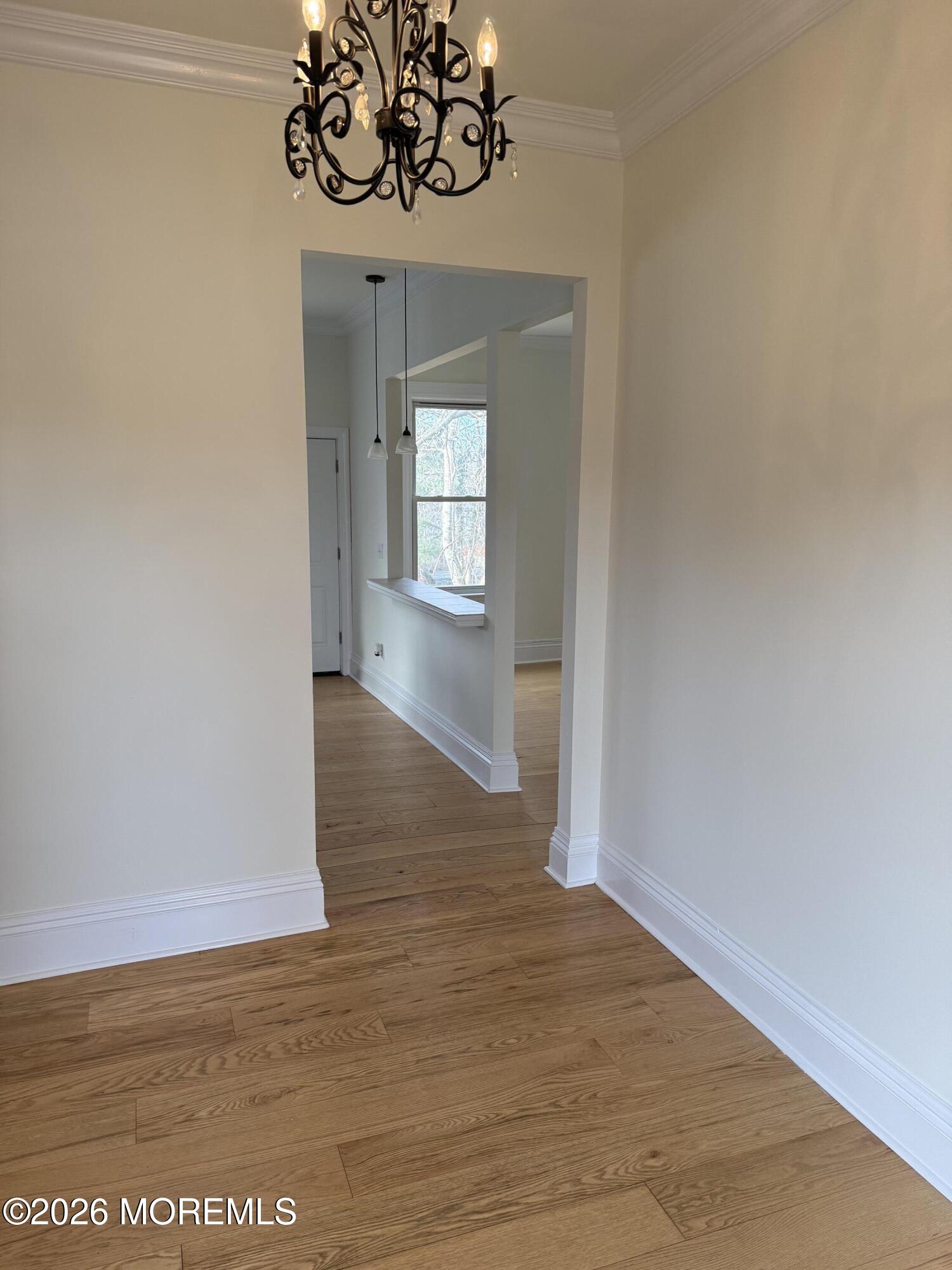 25 Monmouth Road, Unit 3 Oceanport, NJ 07757 - Photo 4 of 21 a view of a room with wooden floor and ceiling fan