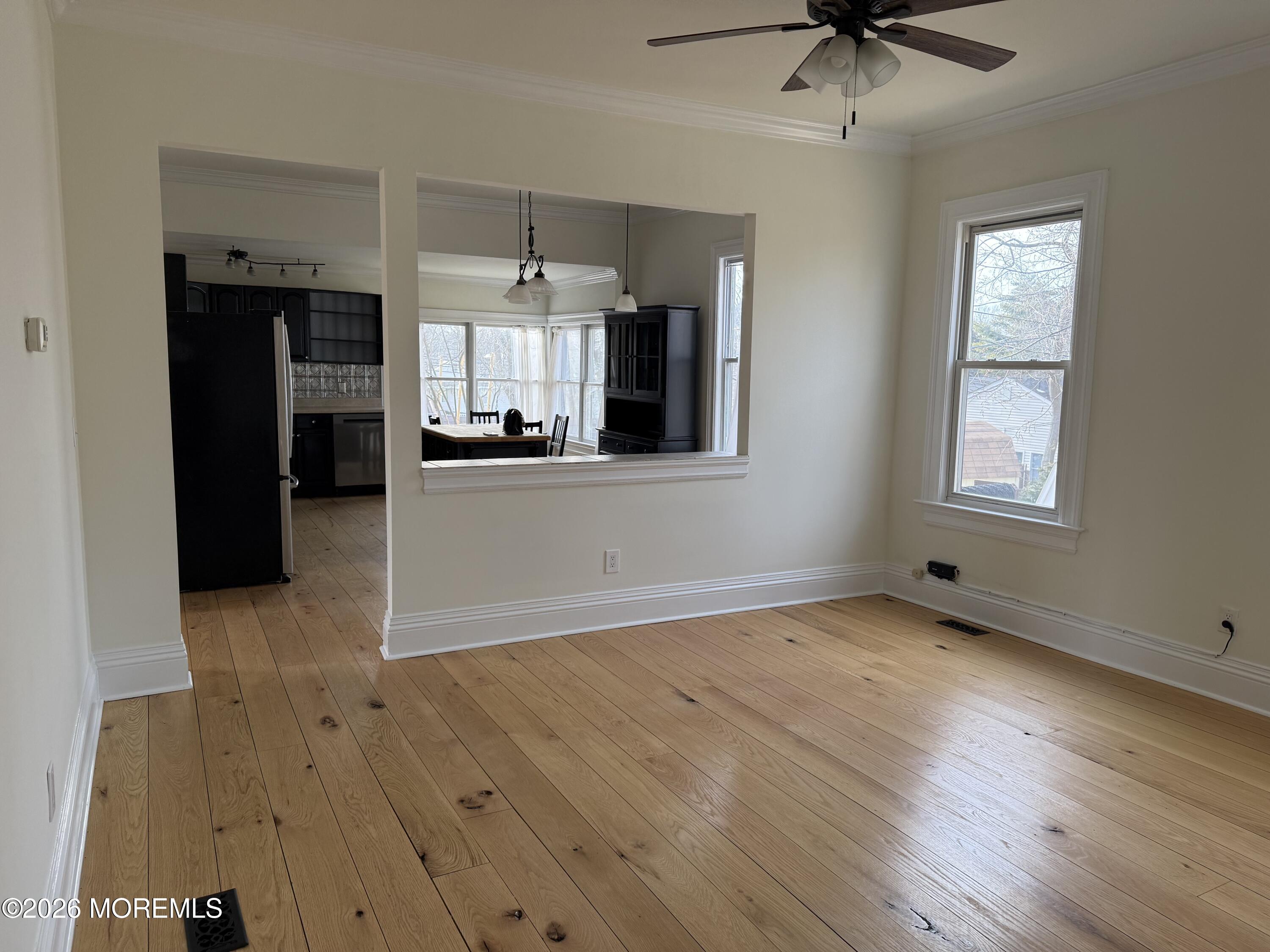 25 Monmouth Road, Unit 3 Oceanport, NJ 07757 - Photo 7 of 21 wooden floor in an empty room with a window