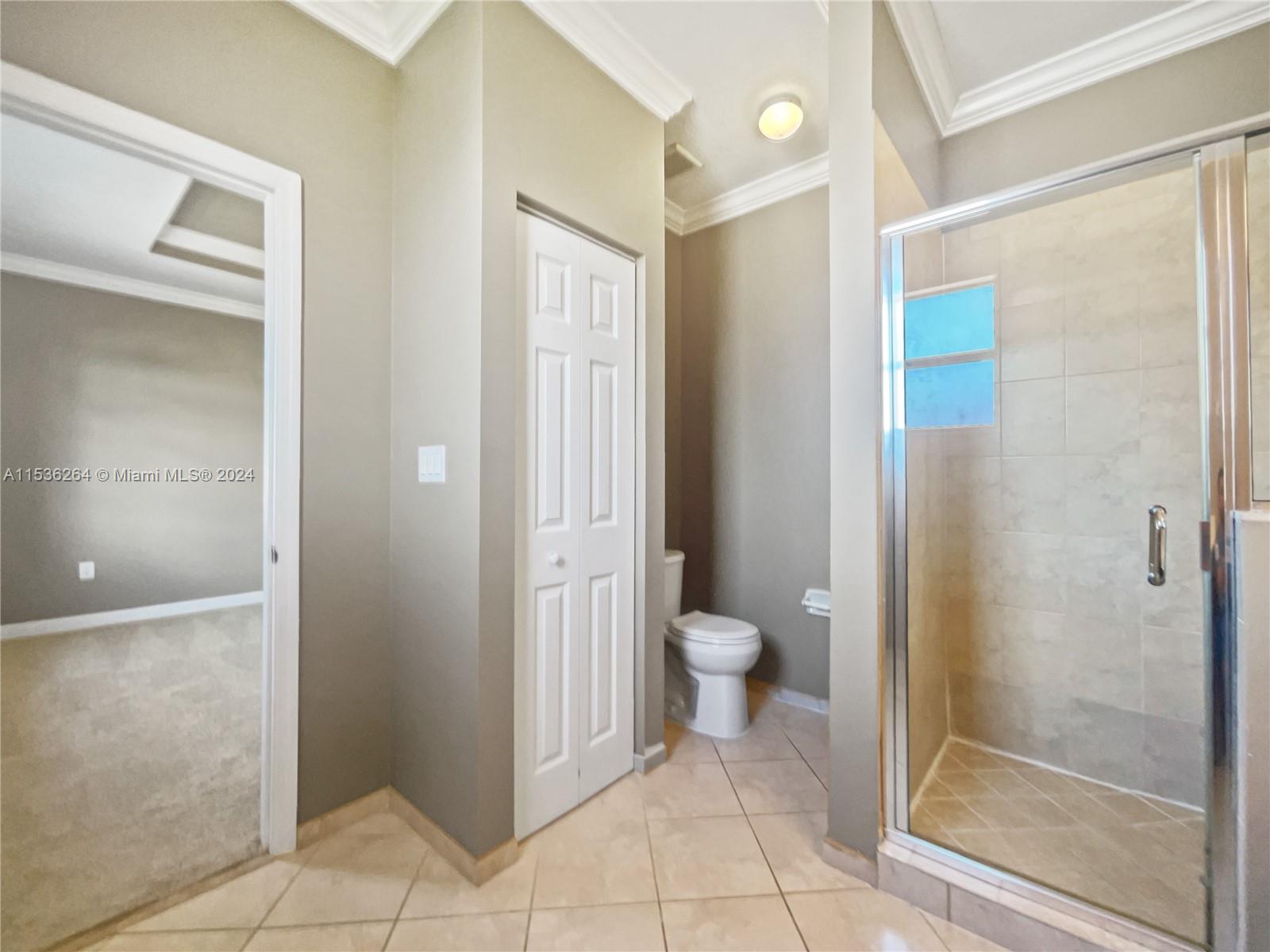 11351 Southwest 240th Street, Unit 1 Homestead, FL 33032 - Photo 19 of 24 a bathroom with a toilet and a shower