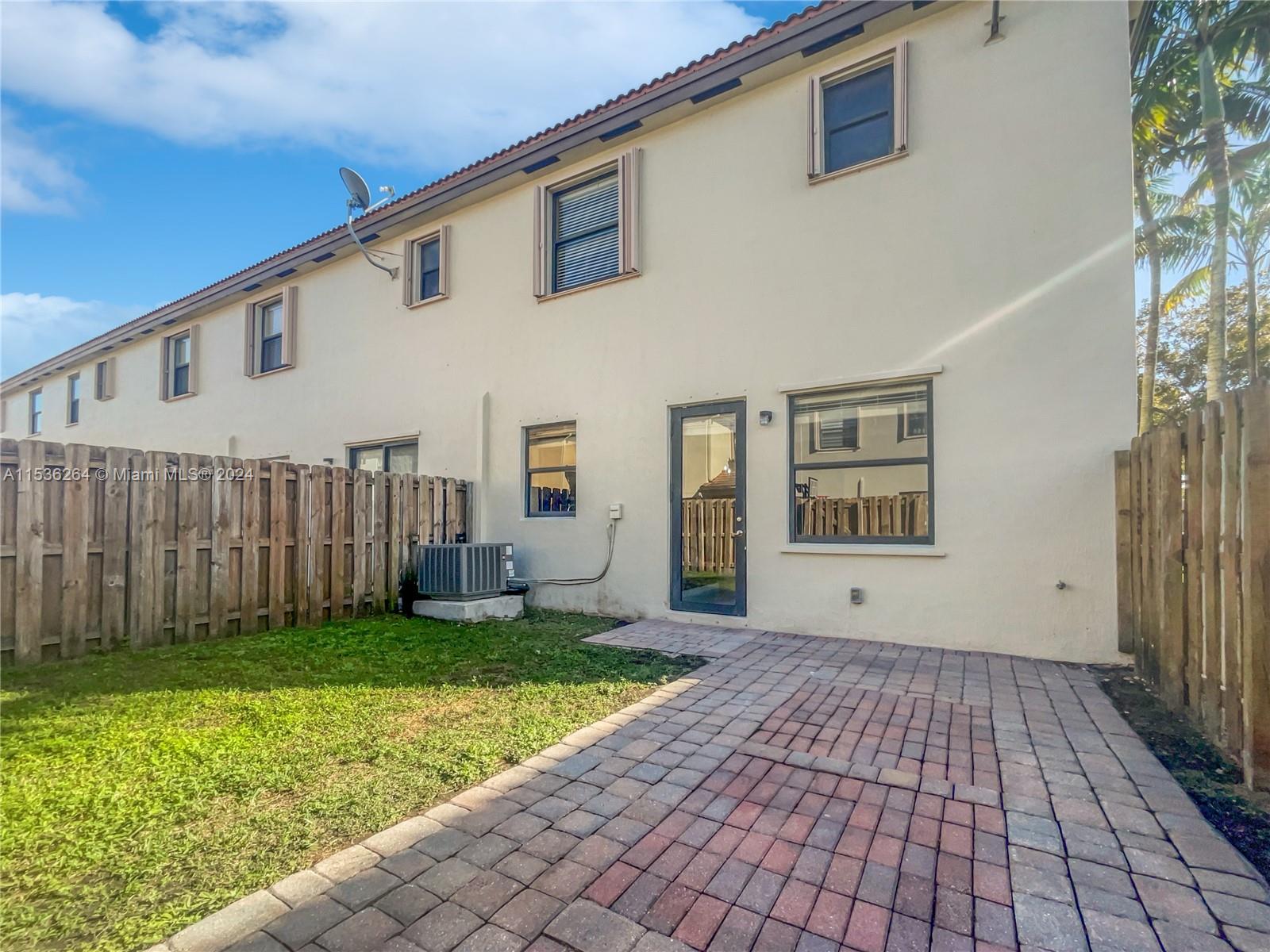 11351 Southwest 240th Street, Unit 1 Homestead, FL 33032 - Photo 21 of 24 a view of a backyard of the house
