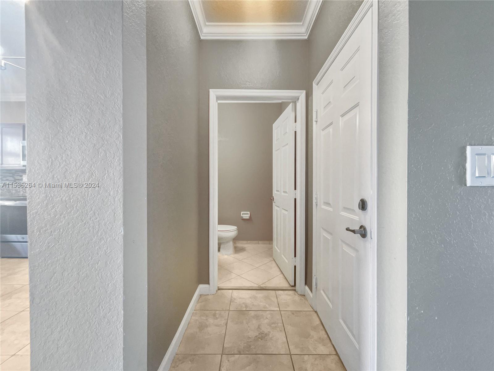 11351 Southwest 240th Street, Unit 1 Homestead, FL 33032 - Photo 5 of 24 a view of a hallway